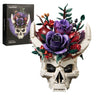 Gothic Skull Floral Bouquet building set with a white skull, purple and red flowers, green leaves and curved white horns, shown beside the product box