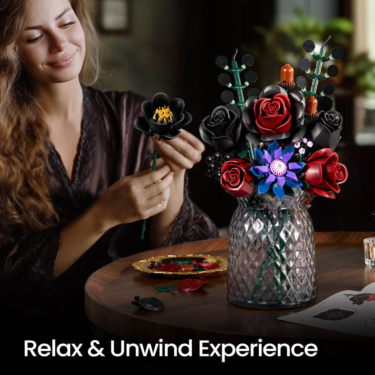 Close-up of a person building a gothic flower bouquet set, attaching flower components while creating a dark floral arrangement.