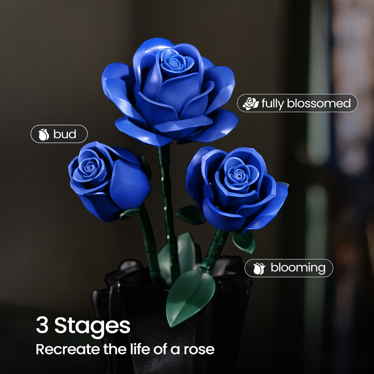 A blue rose building block set displayed in three growth stages, showing rose buds, partially blooming flowers, and fully blossomed roses with green stems and leaves in a black vase.