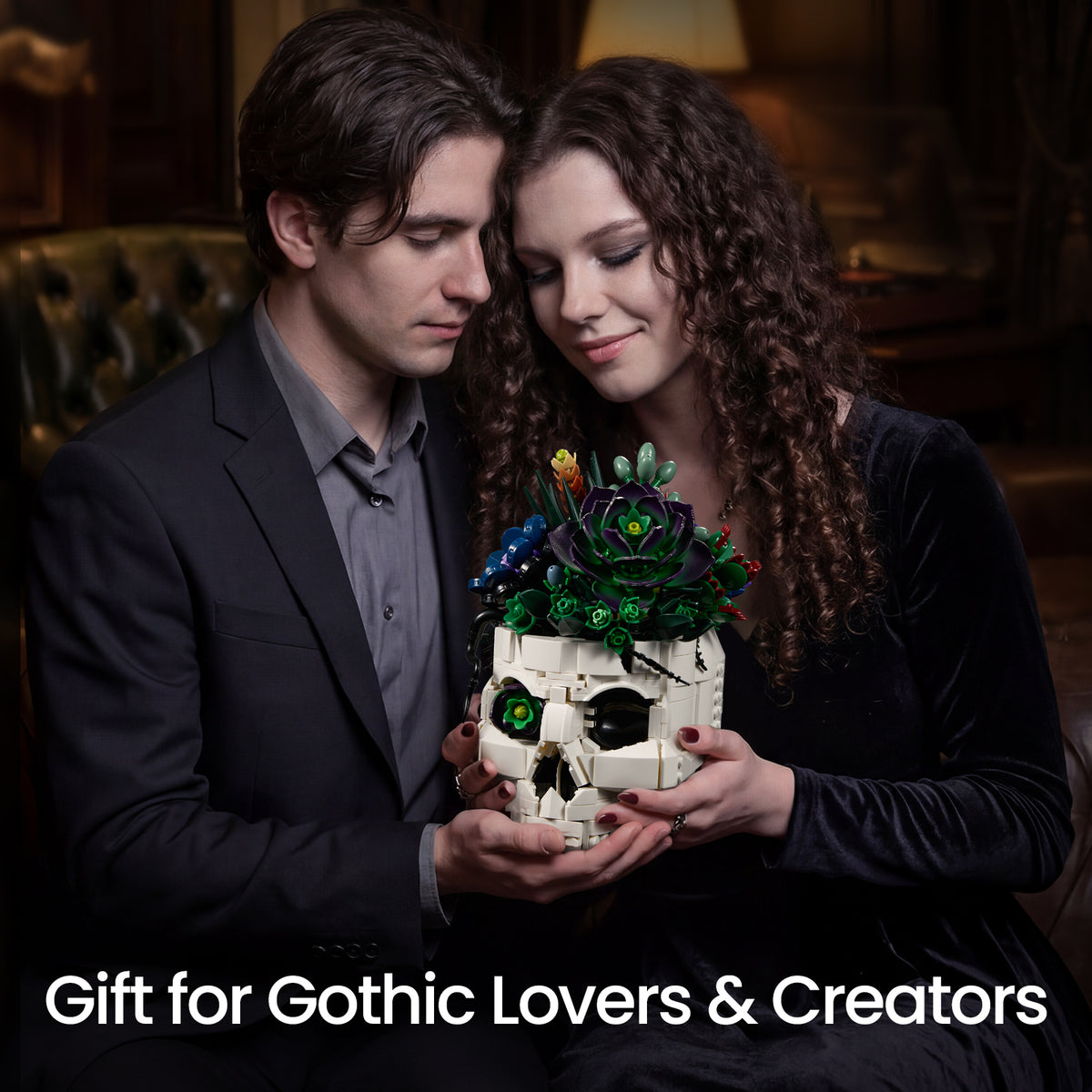 Couple holding a gothic skull succulent bouquet building block set, showing the creative botanical design as a unique gift for gothic lovers and creators.