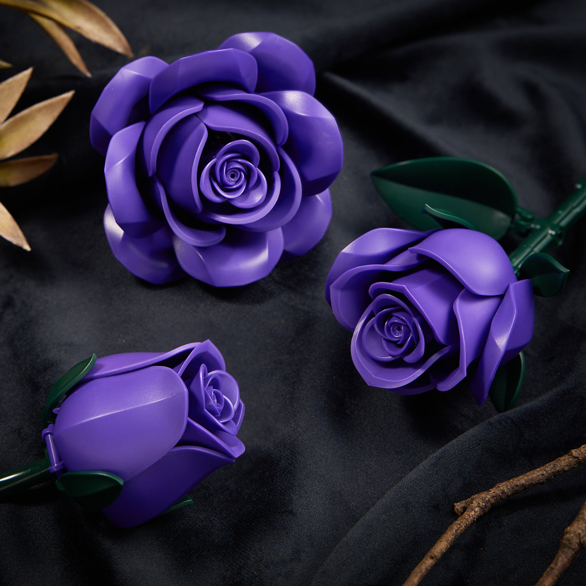 Close-up of purple building block roses showing detailed petals, layered flower shapes, and realistic floral design.