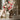 Pink and ivory tulip building bouquet displayed in a fluted white vase on a lace-covered vanity, marked as 40.0 cm high and 18.0 cm wide.