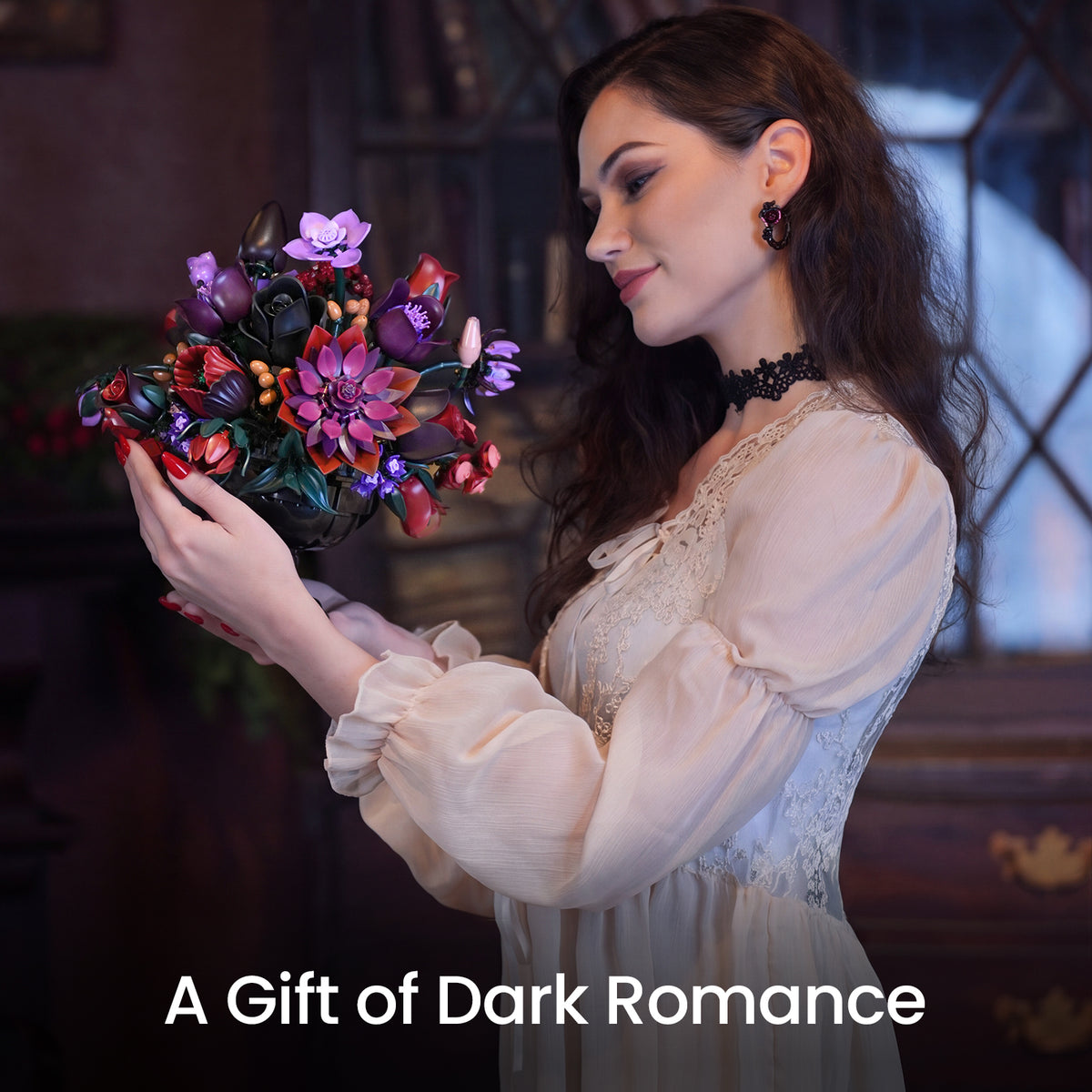 Woman holding a gothic flower building block bouquet with black, red and purple blooms designed as a lasting dark romantic gift.