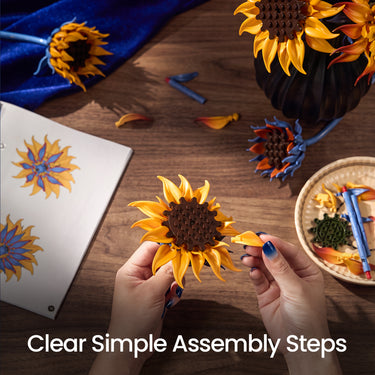 Golden sunflower from the Blazing Sunflower building blocks set being assembled by hand on a wooden table with loose pieces nearby