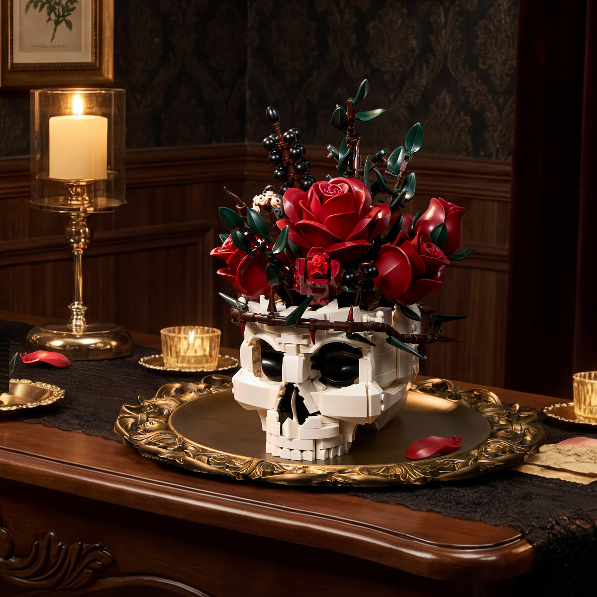 A gothic skull red rose bouquet building block set displayed on an elegant dining table, featuring a white skull base decorated with red roses, green leaves, and dark botanical accents in a vintage dark interior setting.
