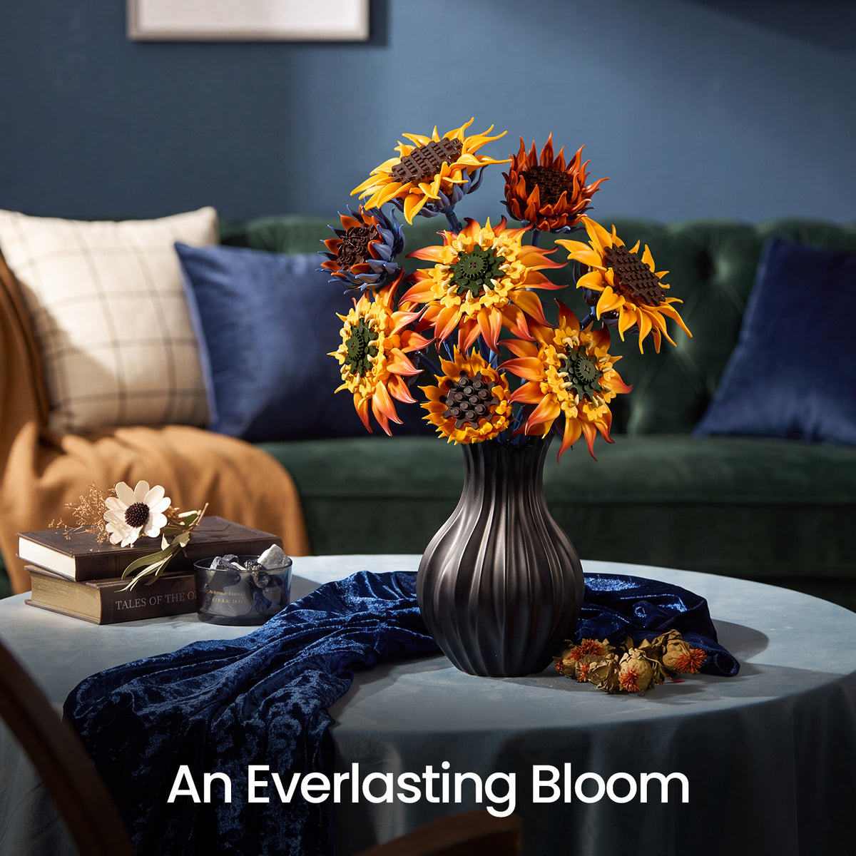 Blazing Sunflower bouquet with golden and orange flowers displayed in a black vase on a coffee table in front of a sofa