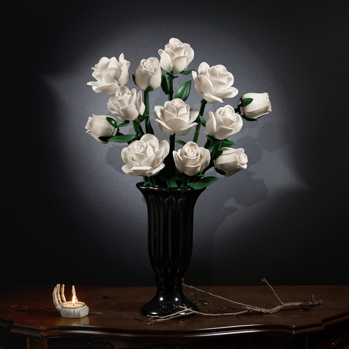 White roses bouquet building block set displayed in a black vase on a wooden table, featuring a full arrangement of elegant white roses with green stems in a dark refined interior setting.