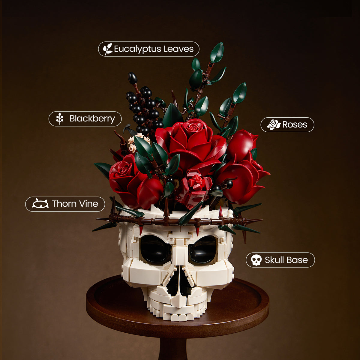 Gothic skull red rose bouquet building block set featuring a white skull base decorated with red roses, eucalyptus leaves, blackberries, and thorn vines, displayed on a round wooden stand.
